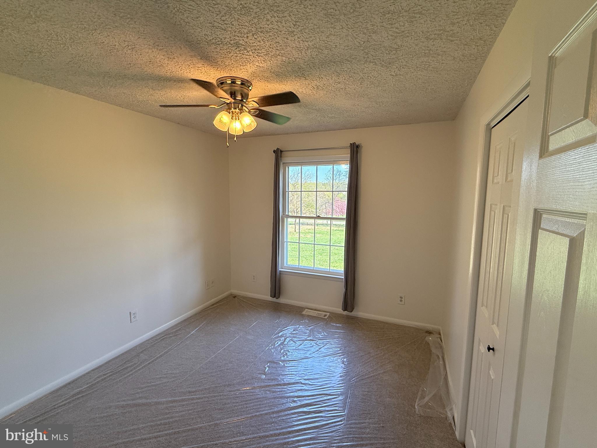 5572 Old Bust Head Road Broad Run, VA 20137 - Photo 21 of 30 a view of empty room with wooden floor