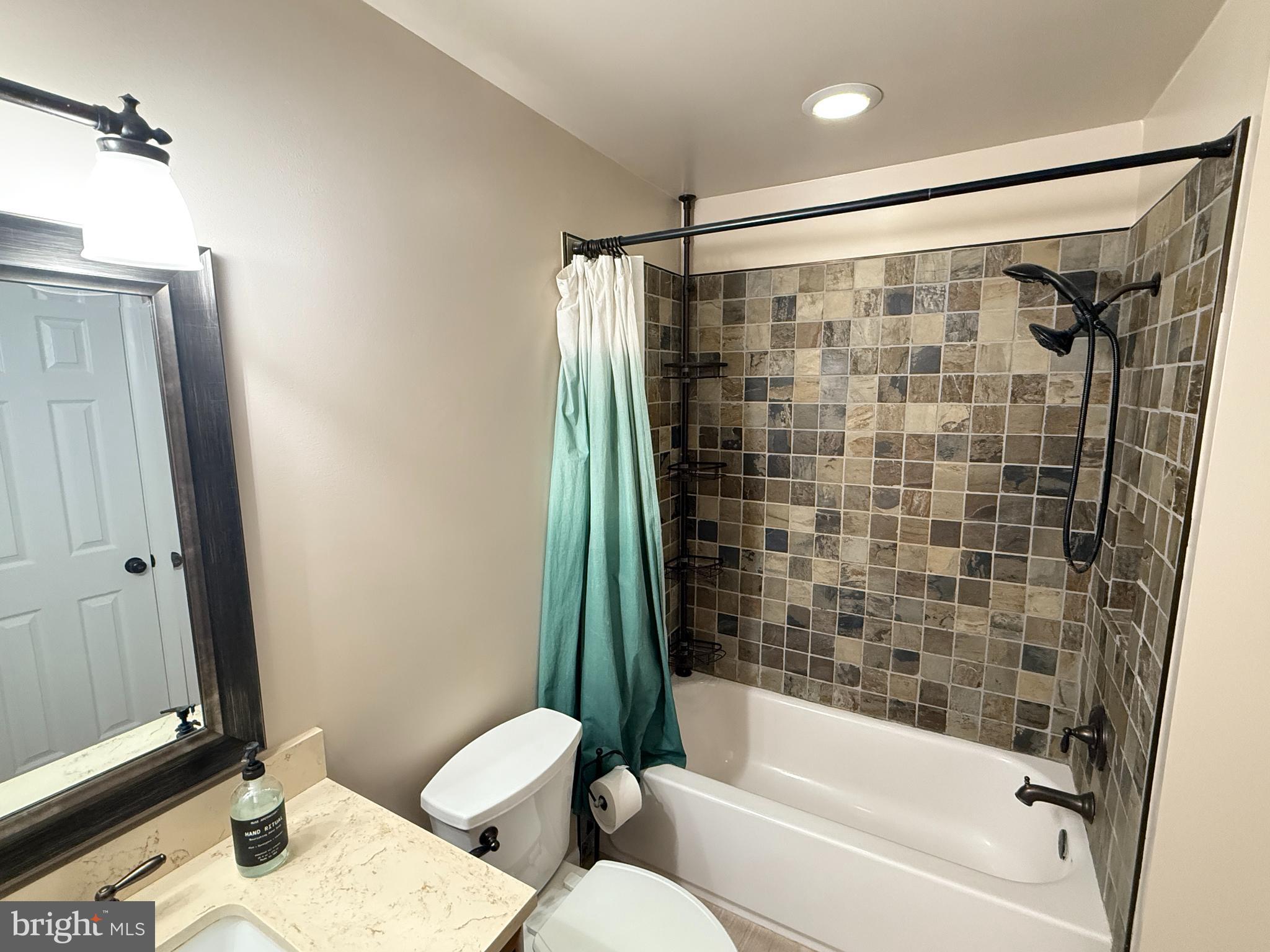 5572 Old Bust Head Road Broad Run, VA 20137 - Photo 22 of 30 a bathroom with a bathtub and a shower