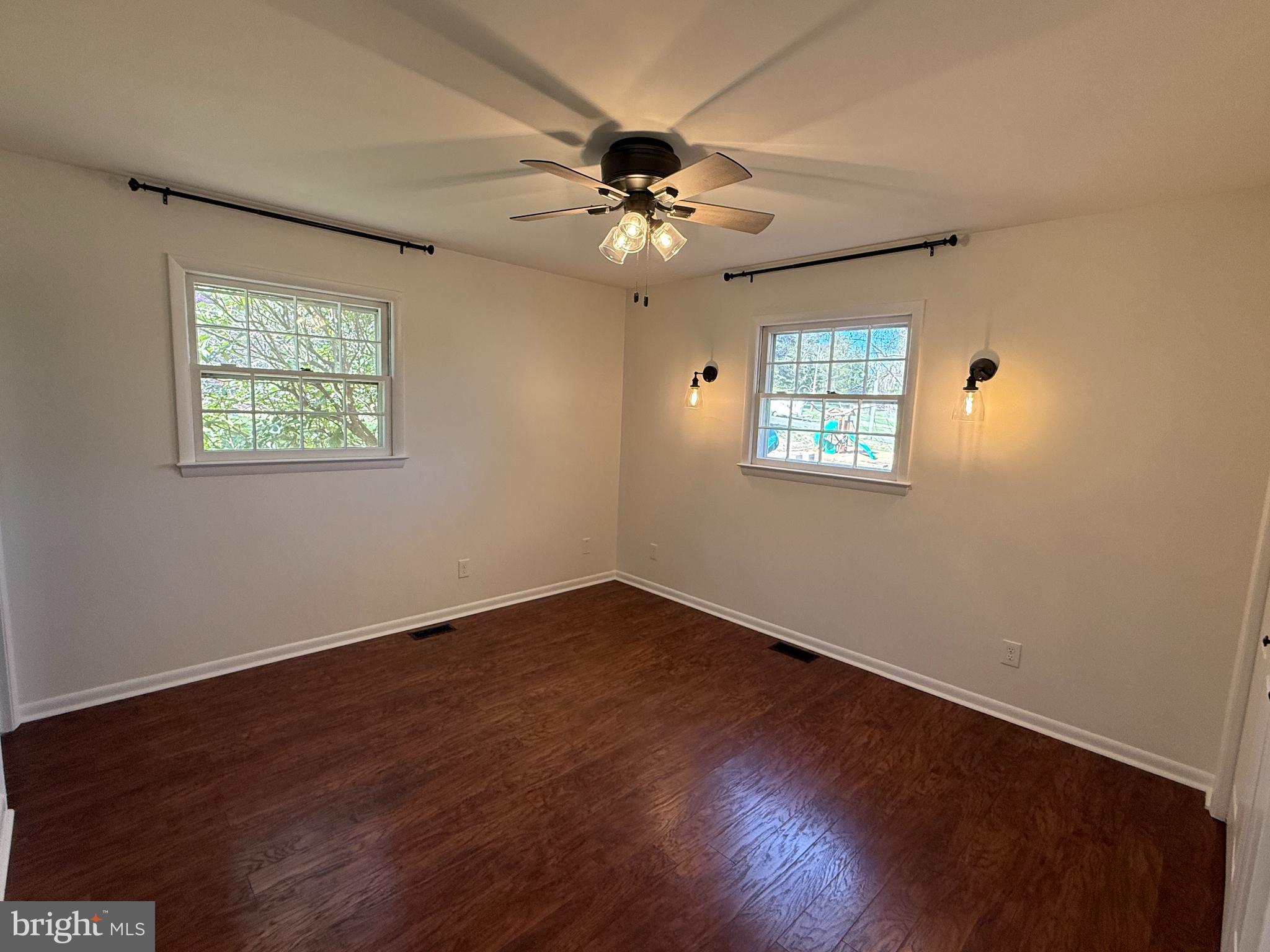 5572 Old Bust Head Road Broad Run, VA 20137 - Photo 26 of 30 a view of an empty room with wooden floor and a window