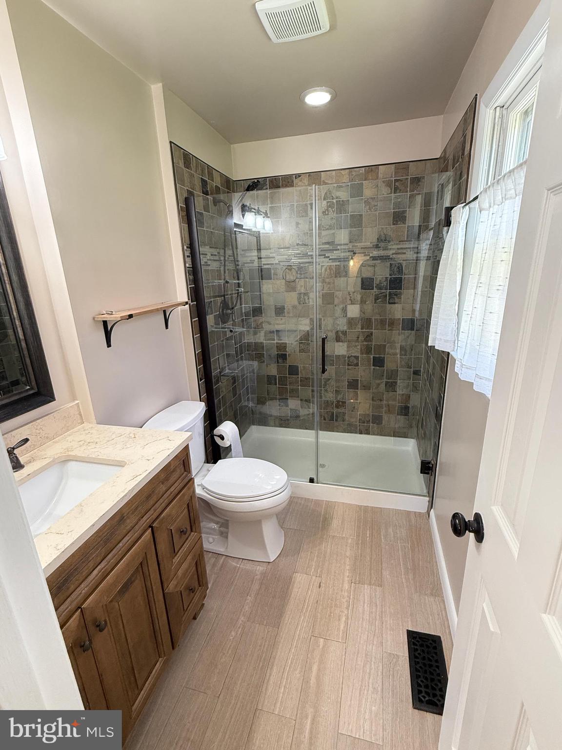 5572 Old Bust Head Road Broad Run, VA 20137 - Photo 29 of 30 a bathroom with a sink and a mirror