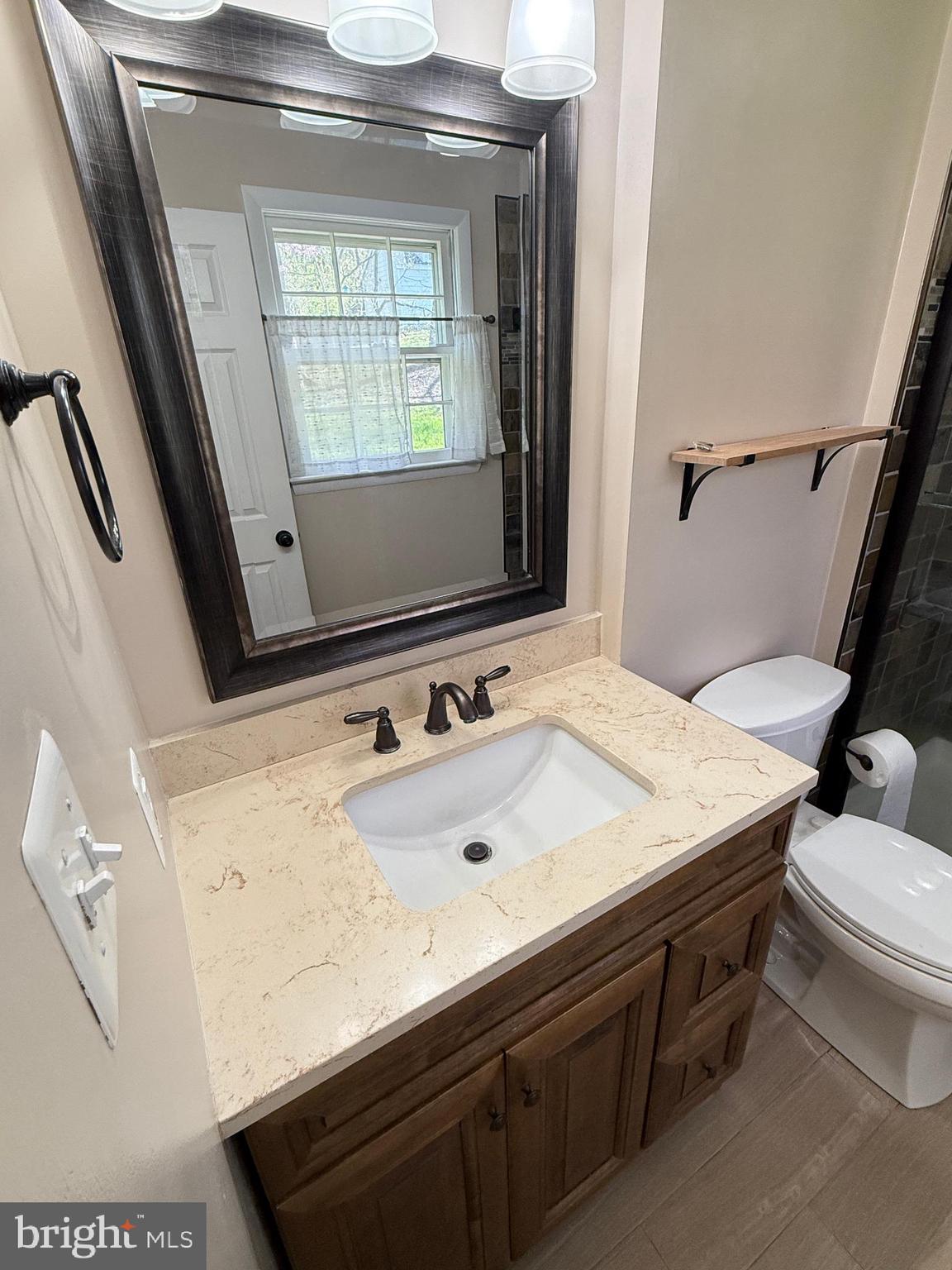 5572 Old Bust Head Road Broad Run, VA 20137 - Photo 30 of 30 a bathroom with a sink and a mirror