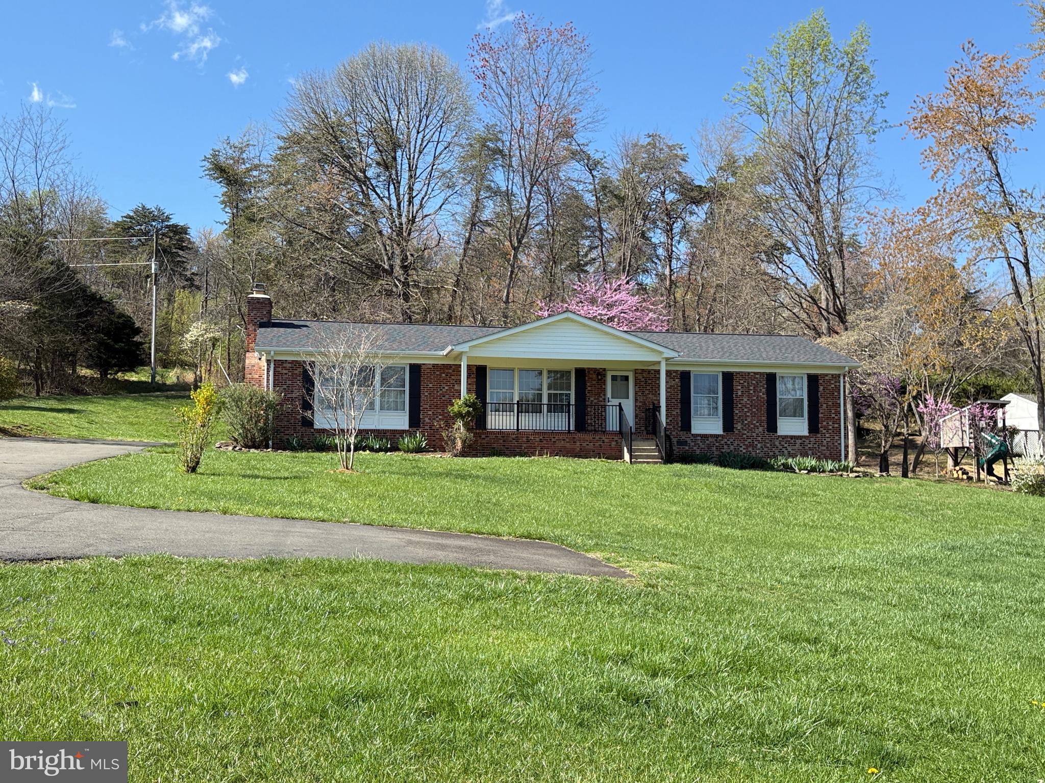 5572 Old Bust Head Road Broad Run, VA 20137 - Photo 3 of 30 a front view of a house with a garden
