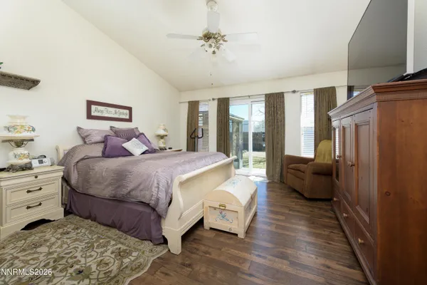 a bedroom with a large bed and a couch