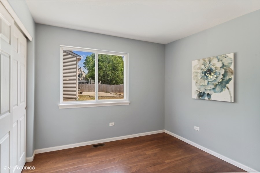115 Periwinkle Lane Bolingbrook, IL 60490 - Photo 12 of 15 an empty room with windows
