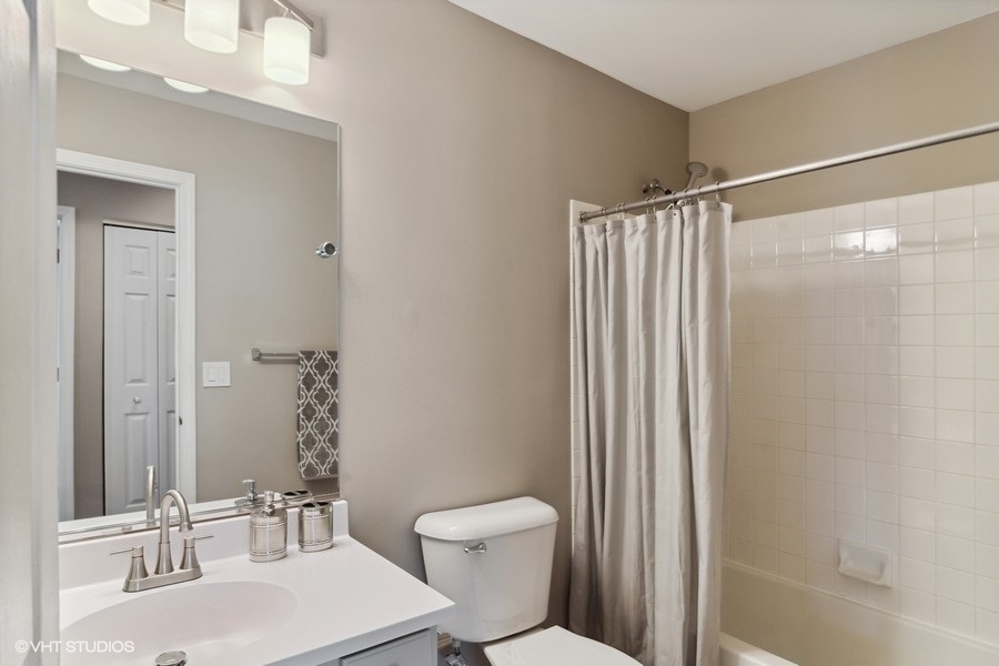 115 Periwinkle Lane Bolingbrook, IL 60490 - Photo 14 of 15 a bathroom with a sink toilet and shower