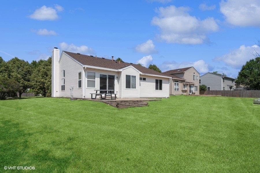 115 Periwinkle Lane Bolingbrook, IL 60490 - Photo 15 of 15 a front view of a house with a garden