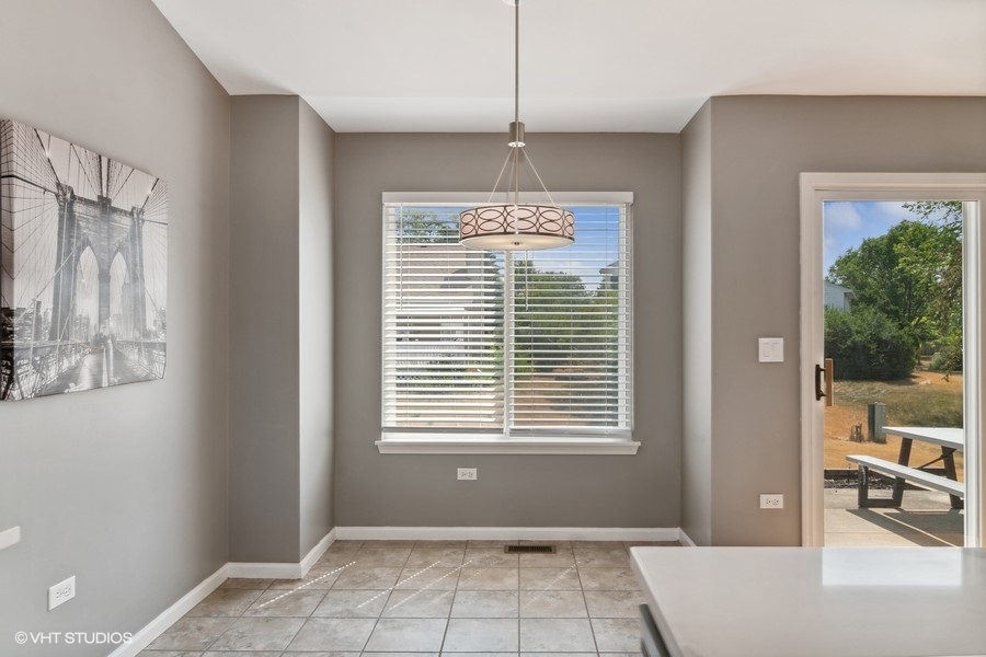 115 Periwinkle Lane Bolingbrook, IL 60490 - Photo 6 of 15 a view of an empty room with a window