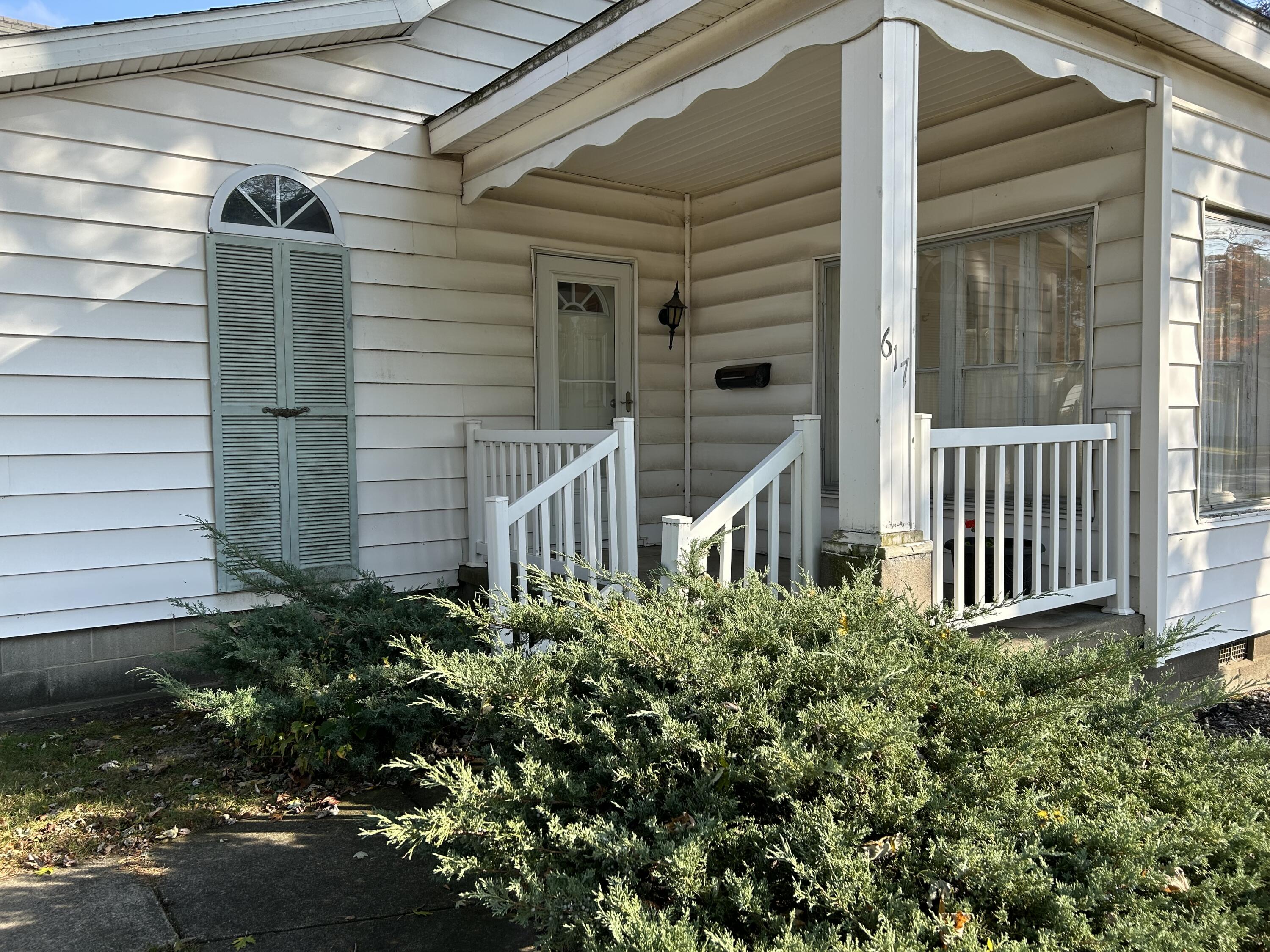 617 North Abigail Street Rensselaer, IN 47978 - Photo 2 of 44 a view of a house with a small yard