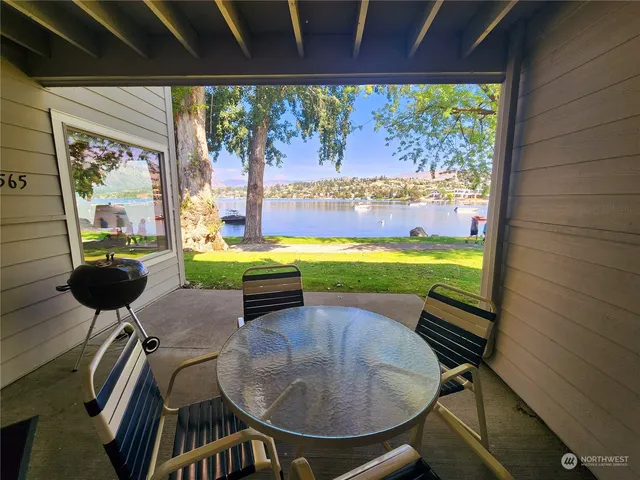 a room with furniture and a floor to ceiling window