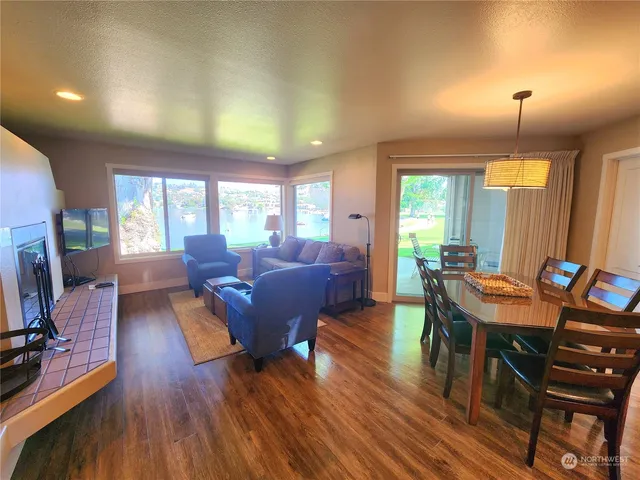 a view of a dining room with furniture window and wooden floor