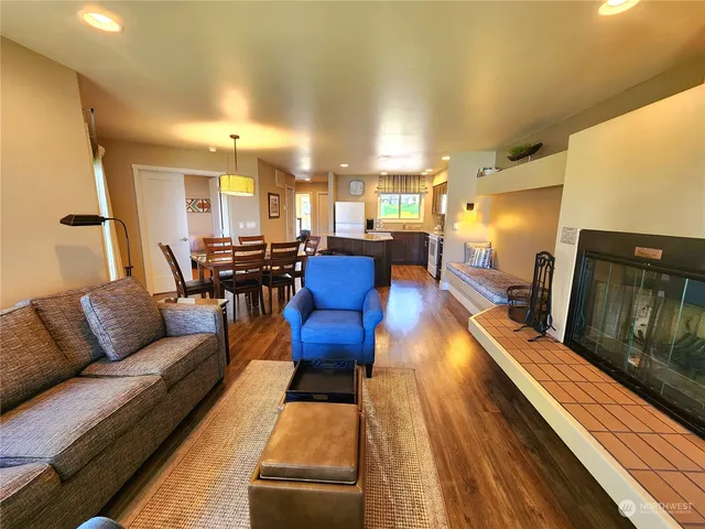 a living room with furniture fireplace and flat screen tv