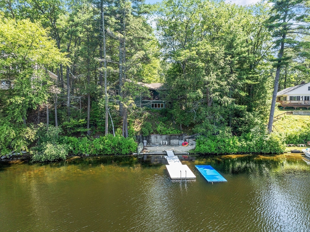 260 Fort Pond Road Lancaster, MA 01523 - Photo 1 of 41 a view of a lake with a house sitting space and swimming pool