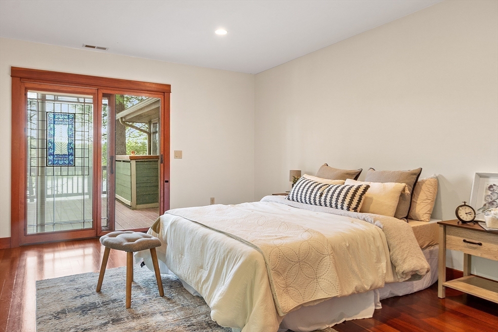 260 Fort Pond Road Lancaster, MA 01523 - Photo 13 of 41 a bedroom with a bed and wooden floor