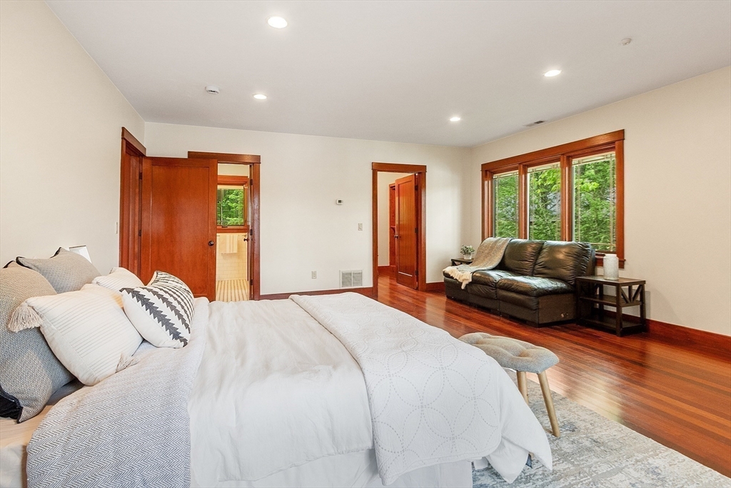 260 Fort Pond Road Lancaster, MA 01523 - Photo 23 of 41 a spacious bedroom with a bed and a couch
