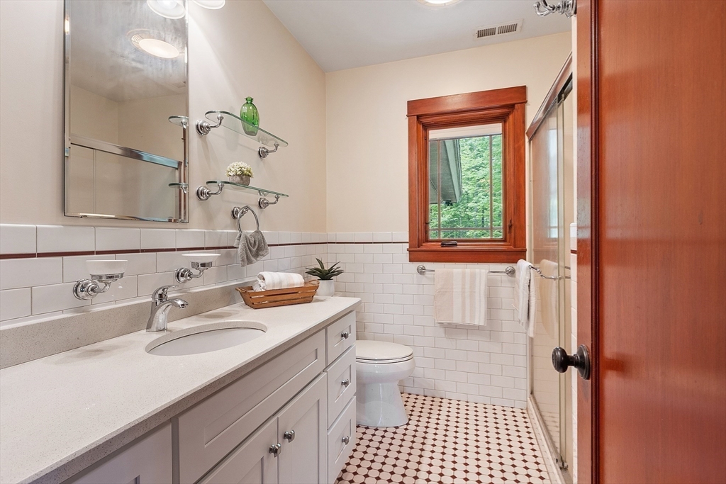 260 Fort Pond Road Lancaster, MA 01523 - Photo 26 of 41 a bathroom with a sink a toilet and a mirror