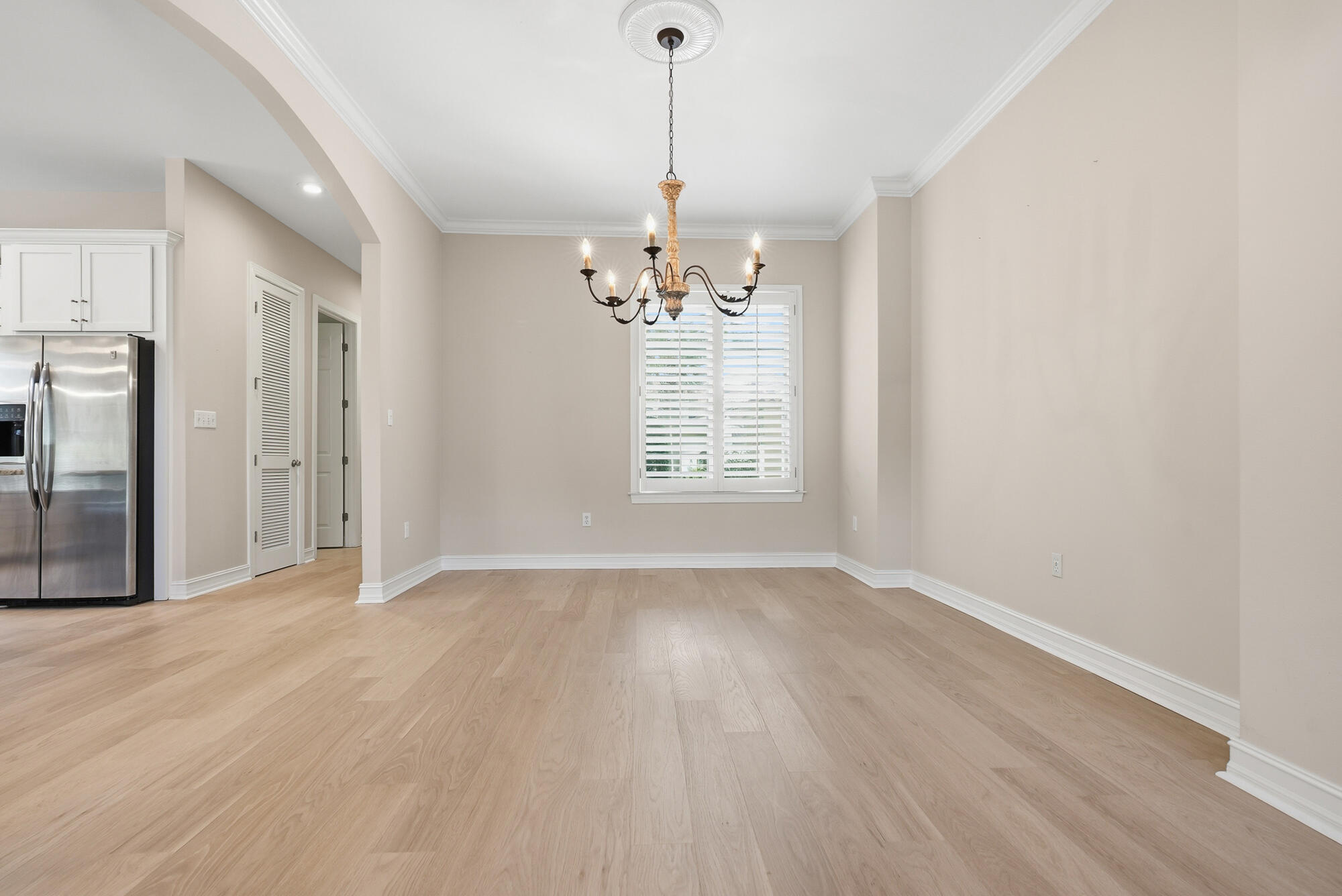413 Sea Winds Drive Santa Rosa Beach, FL 32459 - Photo 14 of 65 a view of a room with wooden floor chandelier and windows