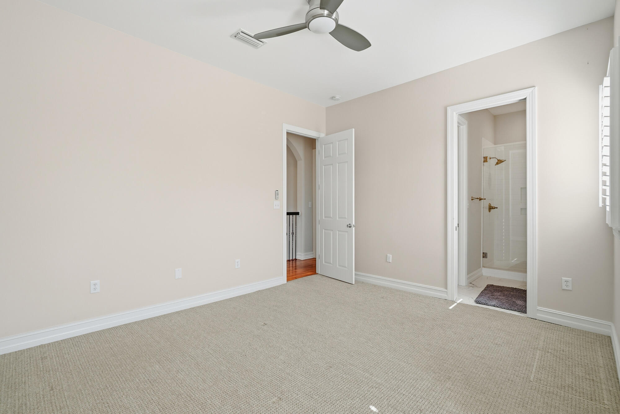 413 Sea Winds Drive Santa Rosa Beach, FL 32459 - Photo 39 of 65 an empty room with a ceiling fan and carpet