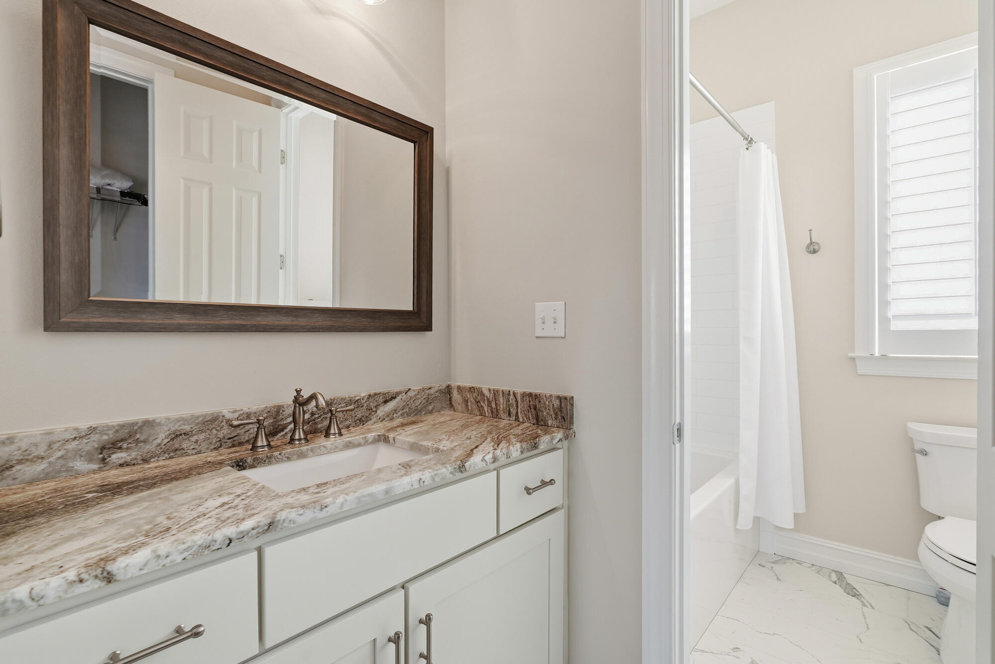 413 Sea Winds Drive Santa Rosa Beach, FL 32459 - Photo 45 of 65 a bathroom with a granite countertop sink and a mirror