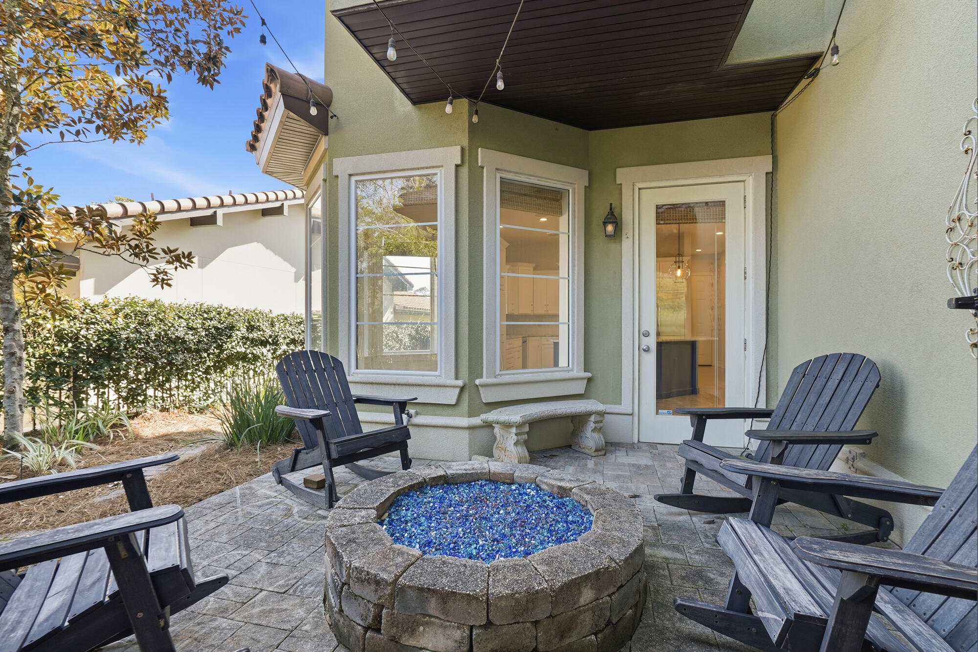 413 Sea Winds Drive Santa Rosa Beach, FL 32459 - Photo 51 of 65 a view of a patio with a dining table and chairs
