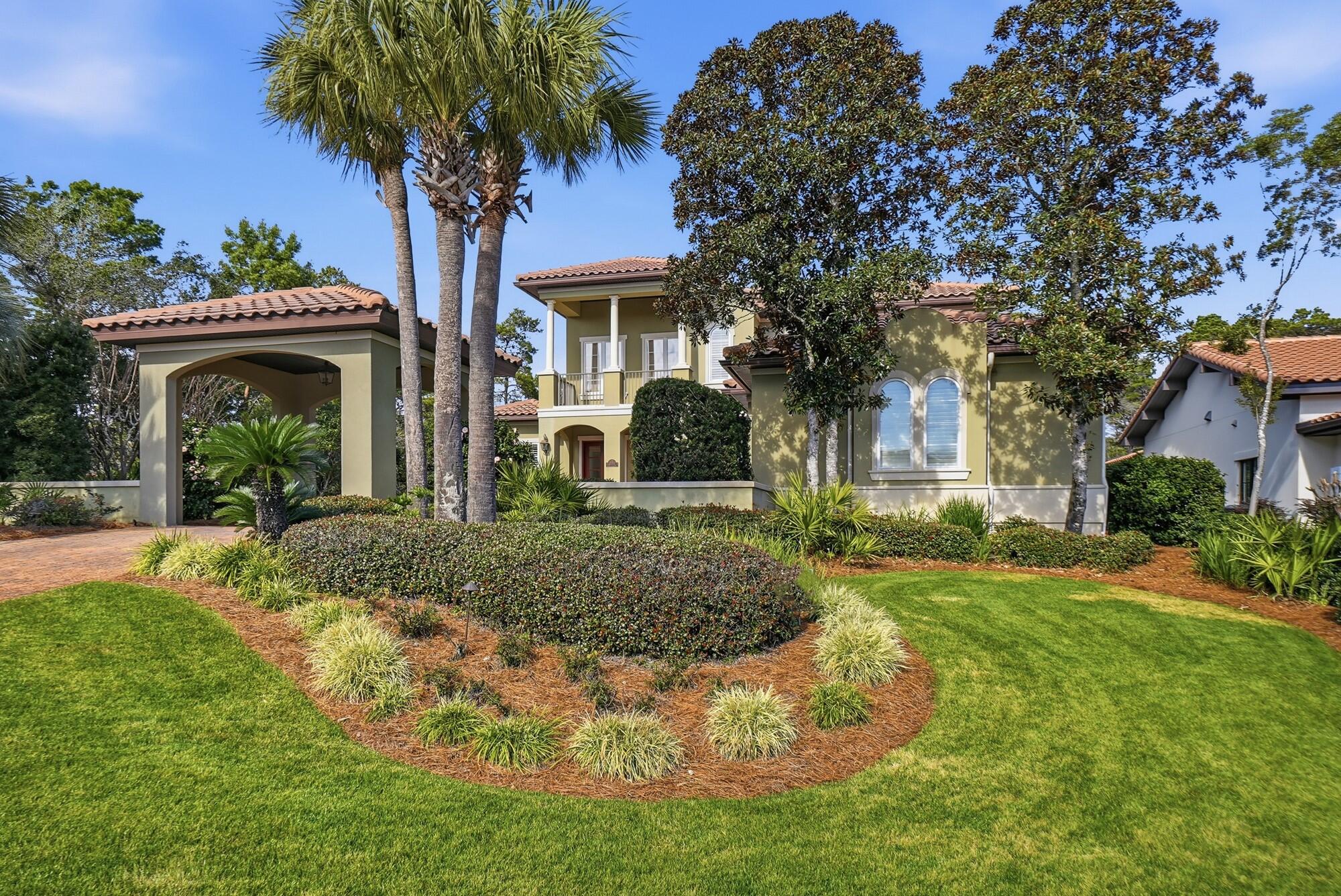 413 Sea Winds Drive Santa Rosa Beach, FL 32459 - Photo 53 of 65 a front view of a house with garden