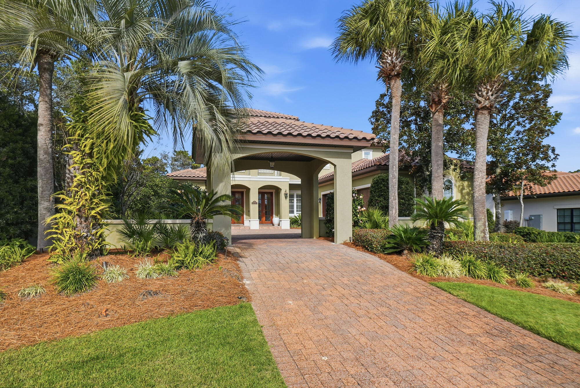 413 Sea Winds Drive Santa Rosa Beach, FL 32459 - Photo 54 of 65 a view of a white house with a yard and potted plants