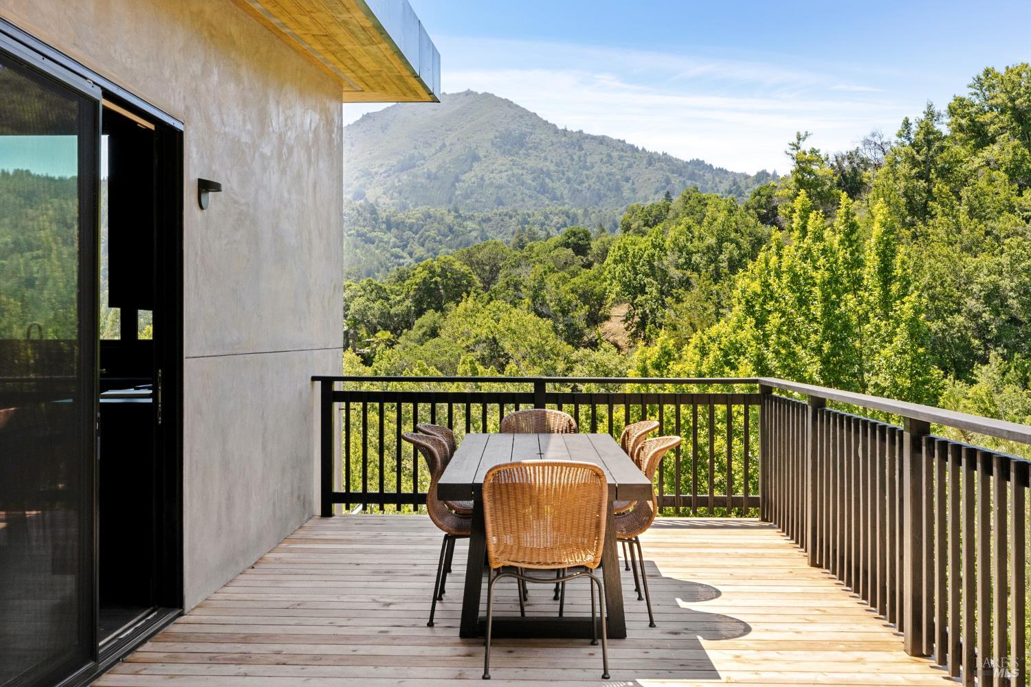 56 Millard Road Larkspur, CA 94939 - Photo 59 of 74 a balcony with wooden floor table and chairs
