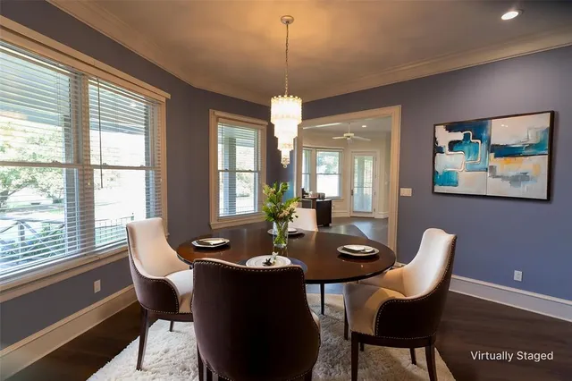 a dining room with furniture and window