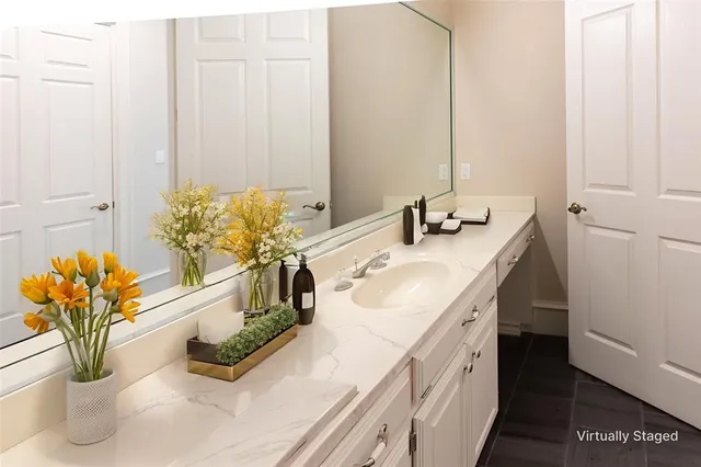 a bathroom with a double vanity sink
