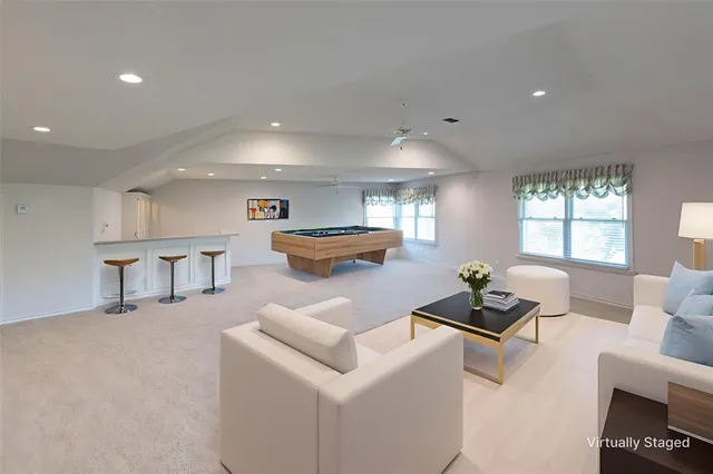 a room with furniture and a large window