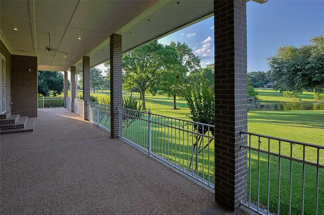 a view of a porch and garden