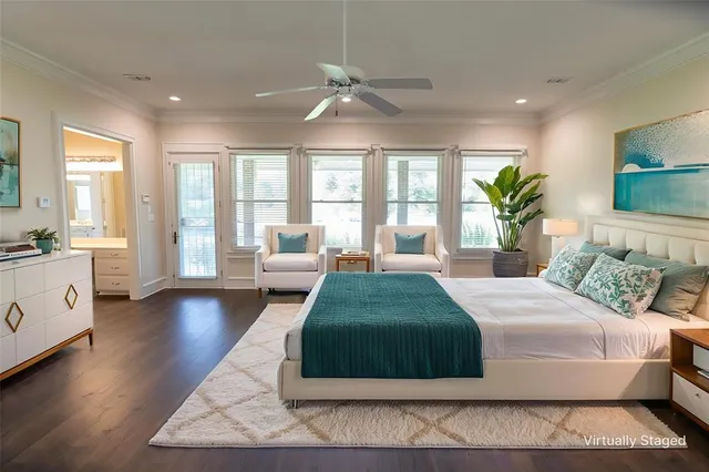 a spacious bedroom with a large bed and a couch