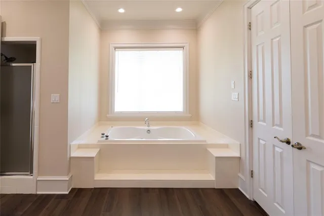 a bathroom with a bathtub and a sink