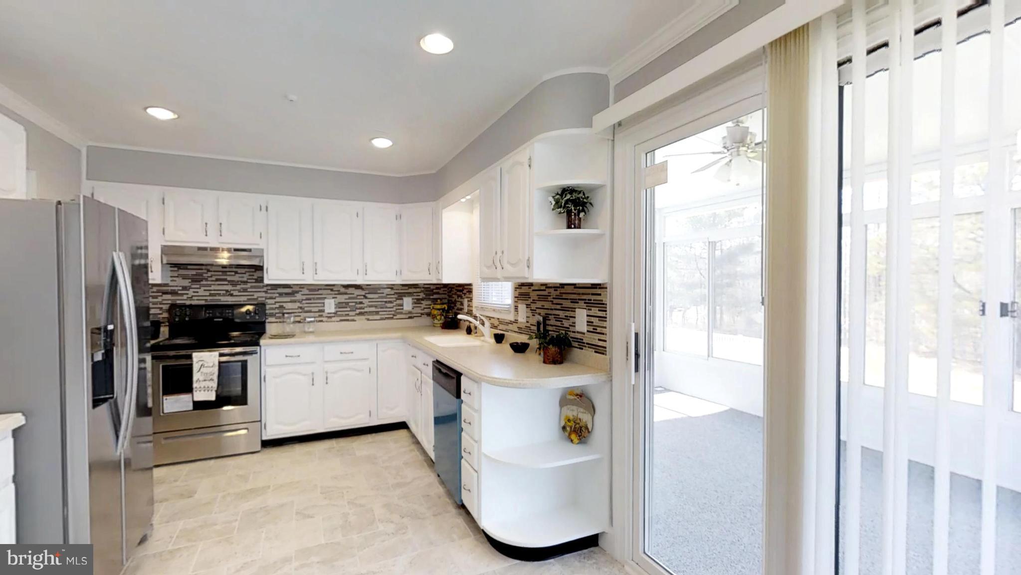 7764 Telegraph Road Severn, MD 21144 - Photo 2 of 24 a kitchen with a sink appliances and cabinets