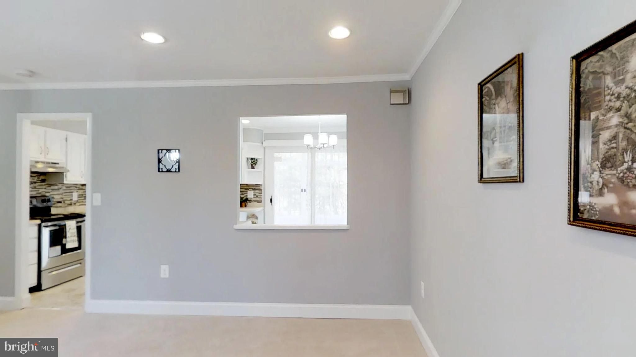 7764 Telegraph Road Severn, MD 21144 - Photo 11 of 24 a bathroom with a bathtub and a window