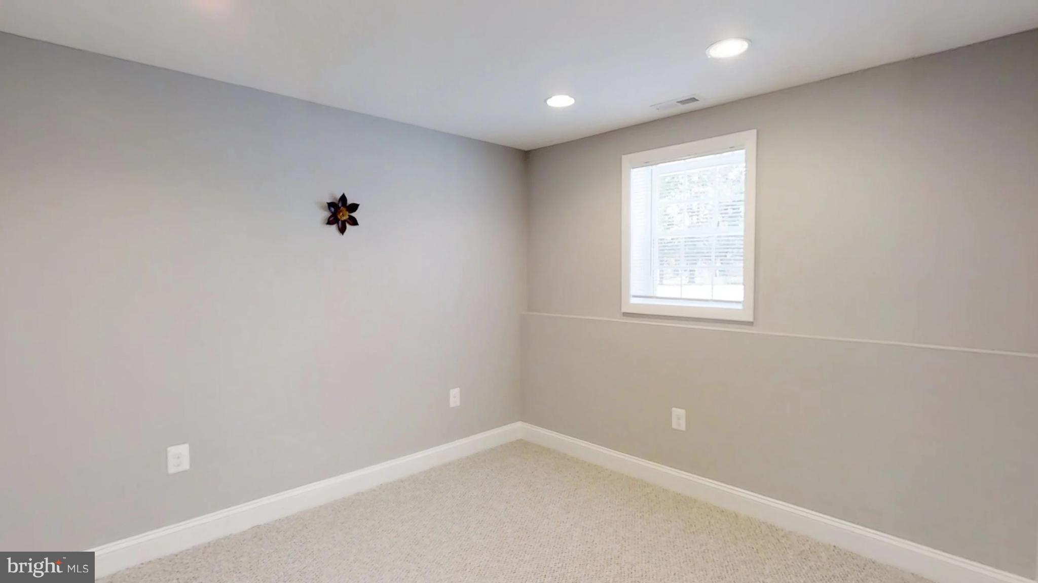 7764 Telegraph Road Severn, MD 21144 - Photo 17 of 24 an empty room with a window