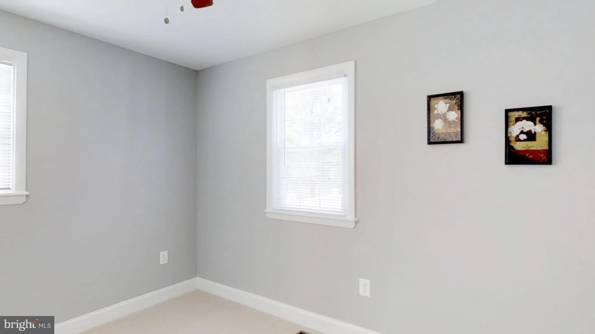 7764 Telegraph Road Severn, MD 21144 - Photo 20 of 24 a bathroom with a bathtub and a window