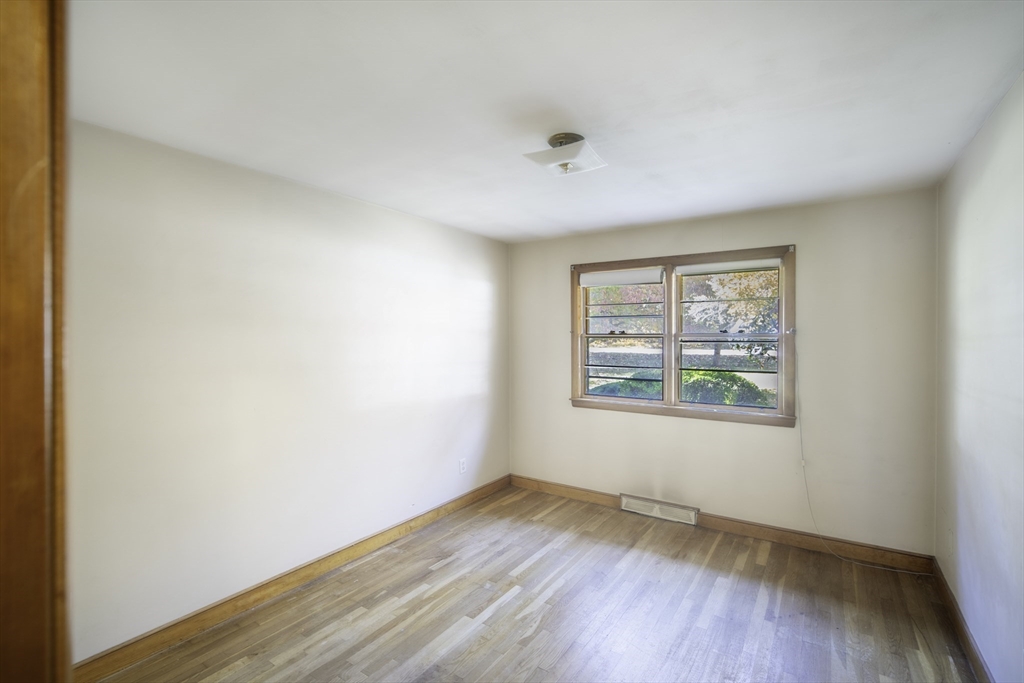 84 Bethany Road Framingham, MA 01702 - Photo 22 of 38 an empty room with wooden floor and windows
