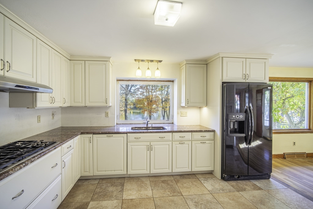 84 Bethany Road Framingham, MA 01702 - Photo 8 of 38 a kitchen with a sink stove and refrigerator