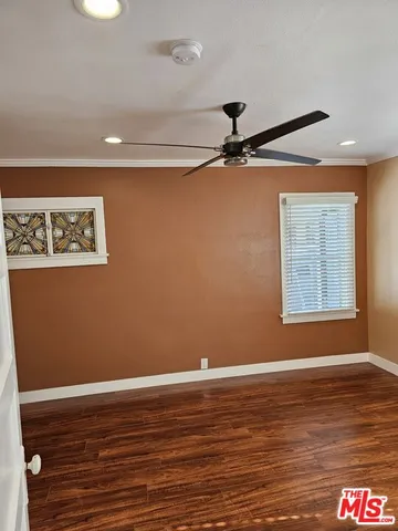 a view of room with wooden floor