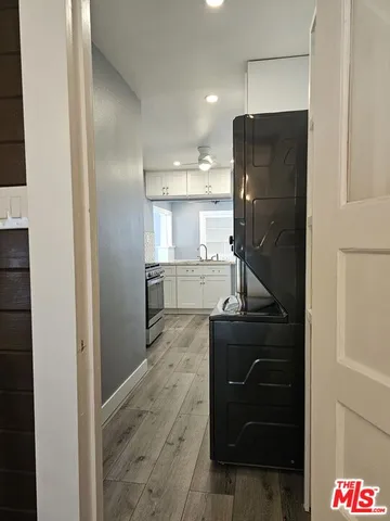 a kitchen with refrigerator and window