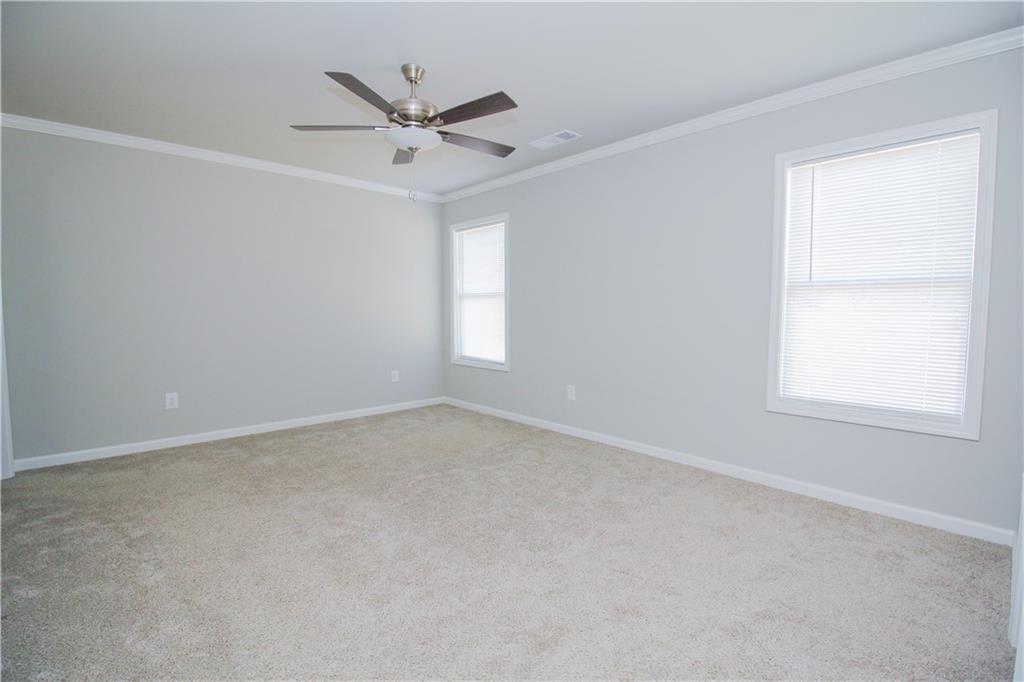 96 Boogies Run Commerce, GA 30529 - Photo 13 of 28 an empty room with a window and a fan