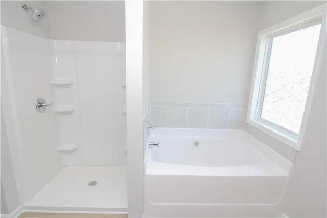 a white bath tub sitting next to a window