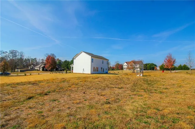 a view of large house with a big yard