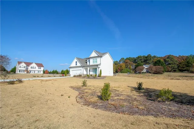 a view of a large body of water with a building in the background