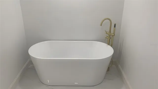 a bathroom with a double vanity sink and mirror