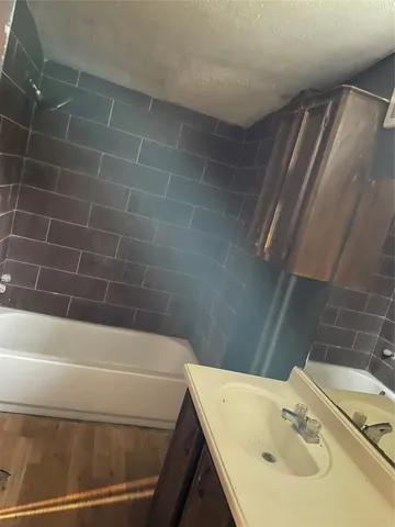 a bathroom with a sink and a bathtub