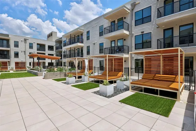 a view of swimming pool with outdoor seating and lake