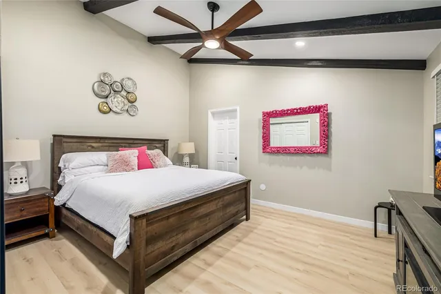 a bedroom with a bed and a table