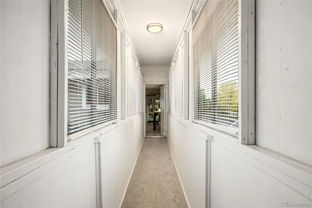 a view of a hallway with windows