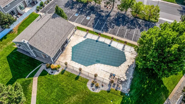 an aerial view of multiple houses with yard